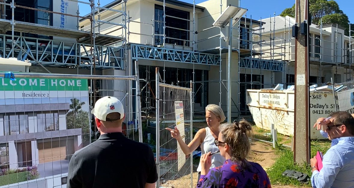 Members on a site tour at a live member project